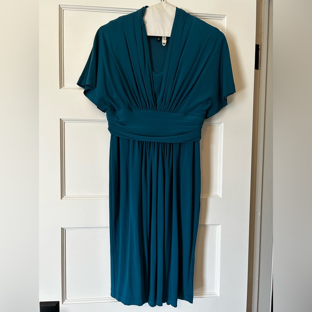 Cute teal blue dress. Sits above knee. Size 8 petite.